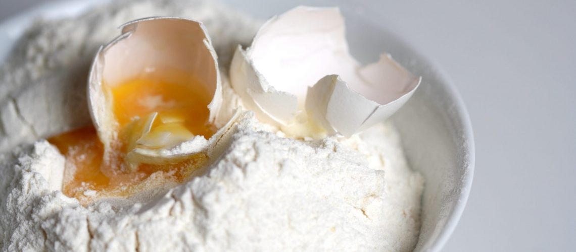 An Egg On Flour to Symbolise a Recipe